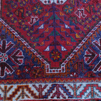 Persian Shiraz rug red ground animal motifs