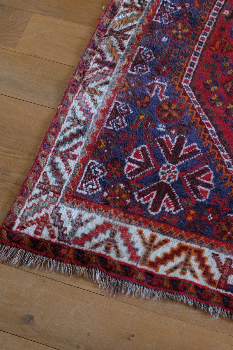 Persian Shiraz rug red ground animal motifs