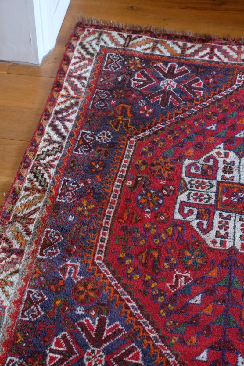 Persian Shiraz rug red ground animal motifs