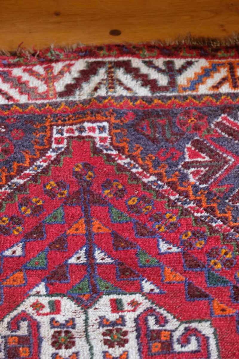 Persian Shiraz rug red ground animal motifs