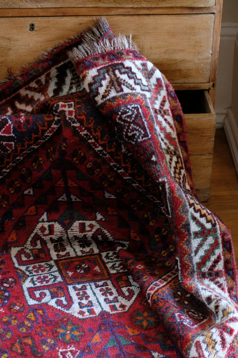 Persian Shiraz rug red ground animal motifs