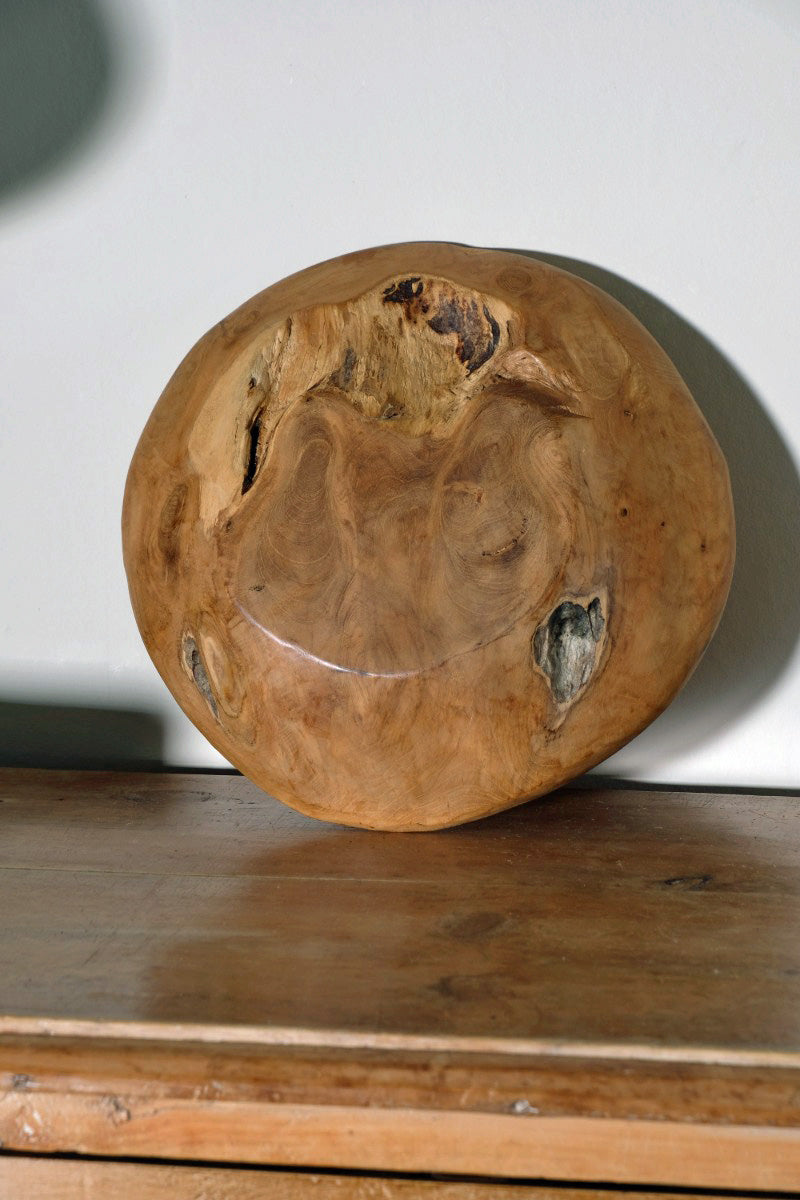 Decorative oak bowl on wooden tabletop