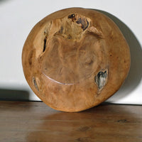 Decorative oak bowl on wooden tabletop