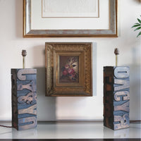 Close‑up of printing block letters forming lamp base