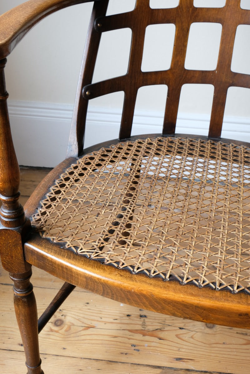 Rare Jas Shoolbred bentwood lattice back armchair with cane seat and pierced Arts & Crafts design