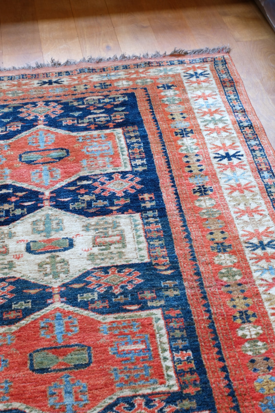Caucasus Kazak wool rug with shield kazak medallions