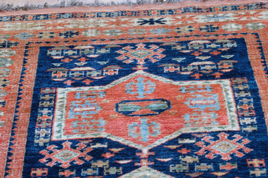 Caucasus Kazak wool rug with shield kazak medallions