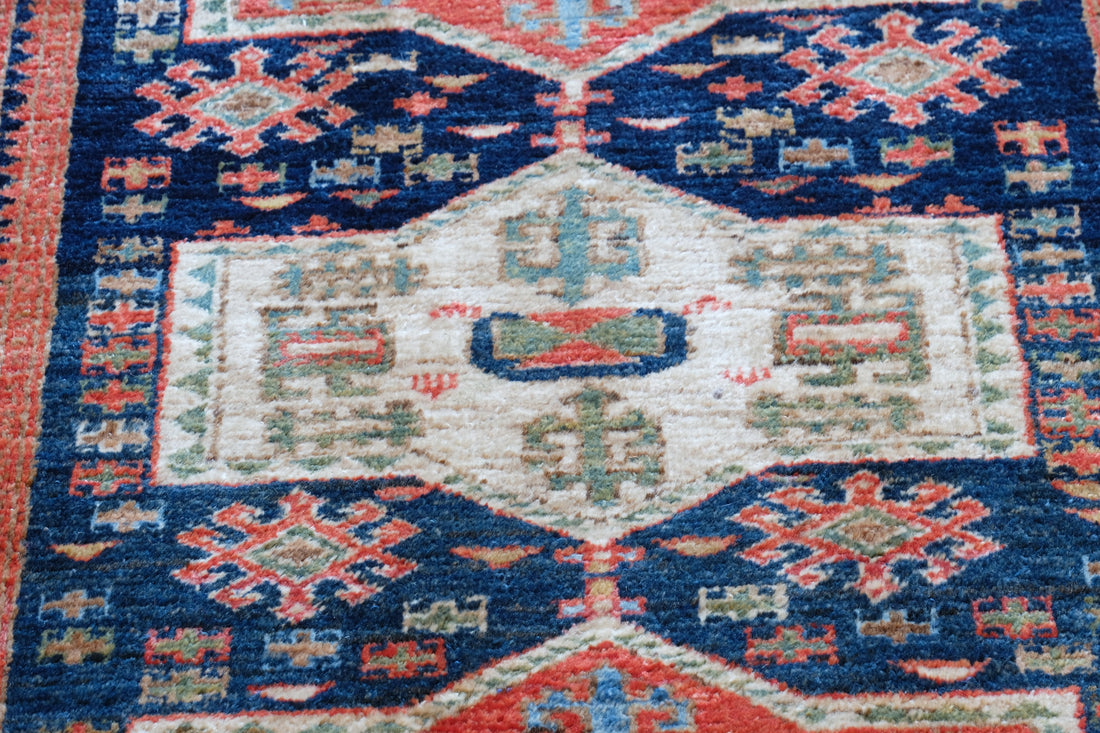 Caucasus Kazak wool rug with shield kazak medallions