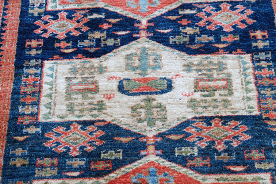 Caucasus Kazak wool rug with shield kazak medallions