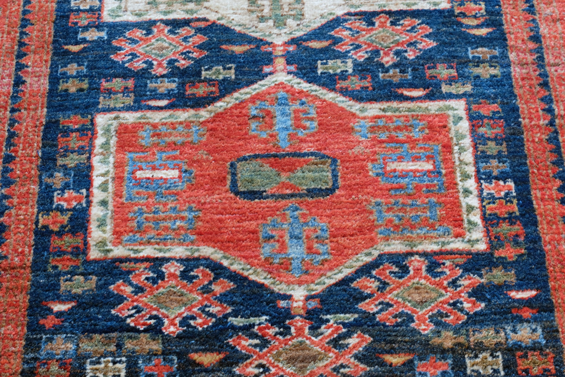 Caucasus Kazak wool rug with shield kazak medallions