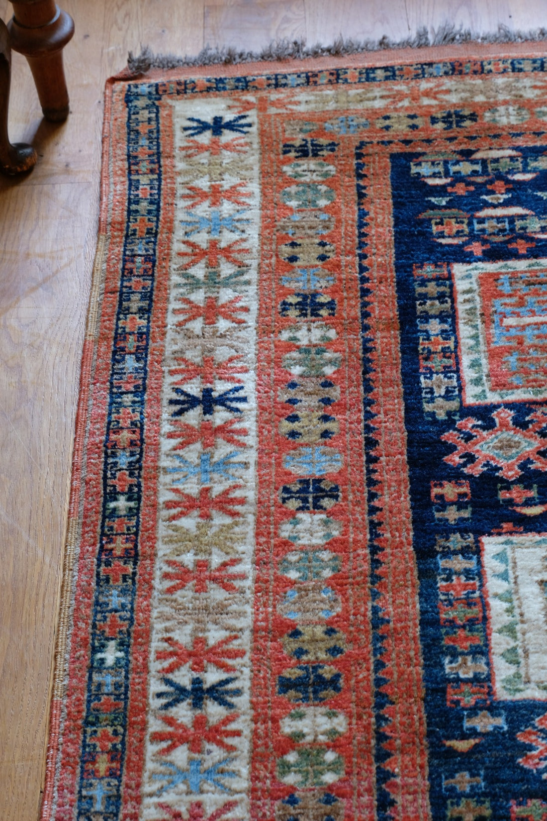 Caucasus Kazak wool rug with shield kazak medallions