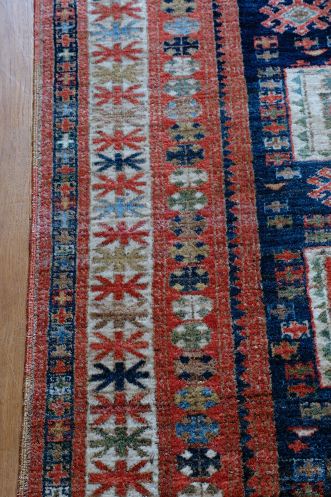 Caucasus Kazak wool rug with shield kazak medallions