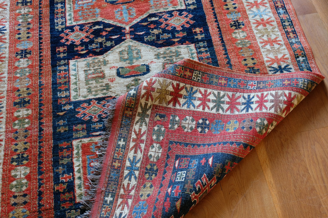 Caucasus Kazak wool rug with shield kazak medallions
