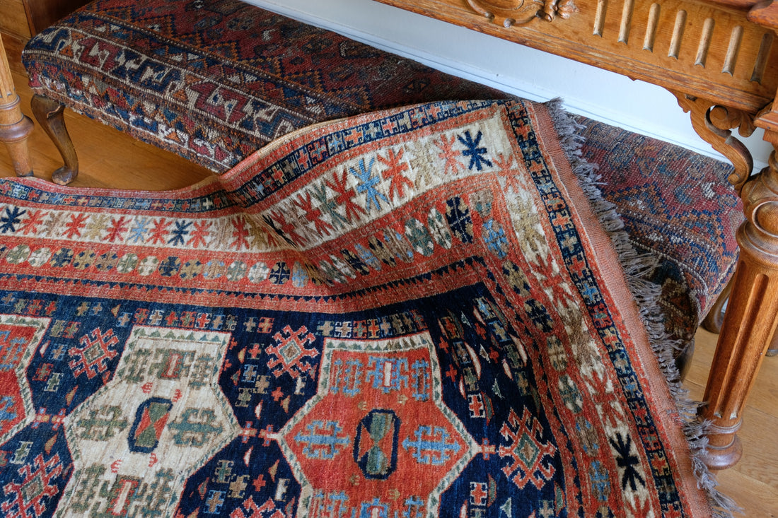 Caucasus Kazak wool rug with shield kazak medallions
