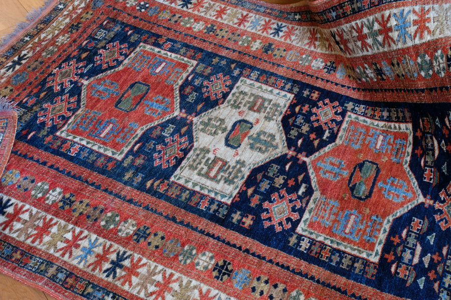 Caucasus Kazak wool rug with shield kazak medallions