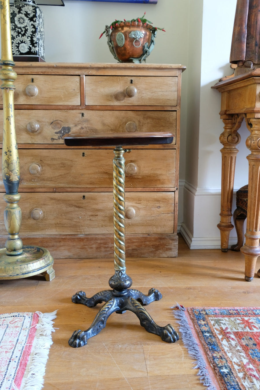 Antique brass telescopic wine table with twisted column and lions paw feet