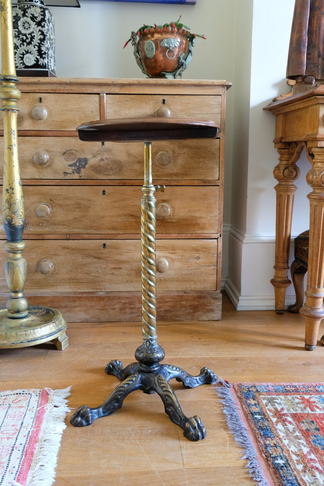 Antique brass telescopic wine table with twisted column and lions paw feet