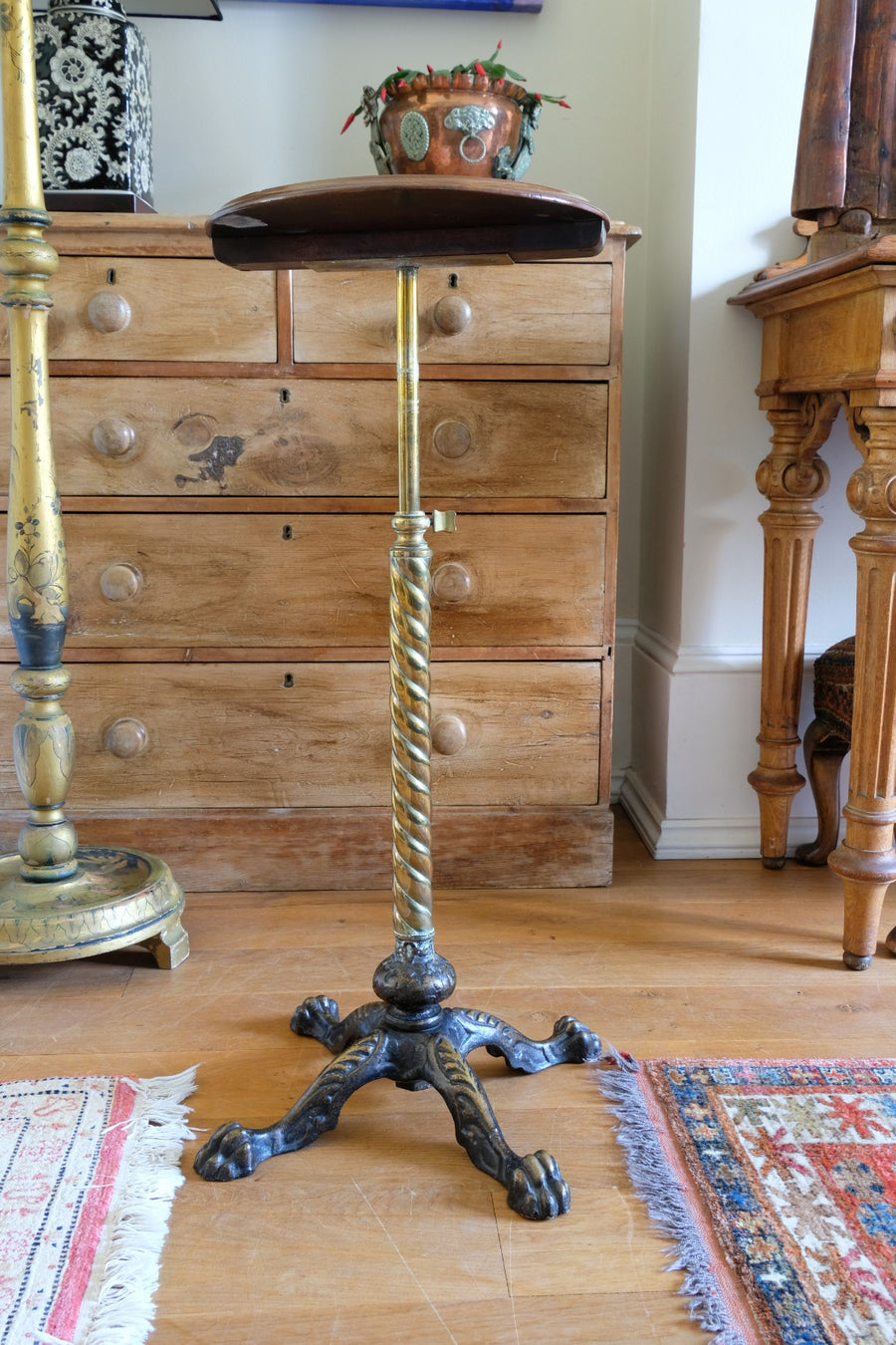 Antique brass telescopic wine table with twisted column and lions paw feet