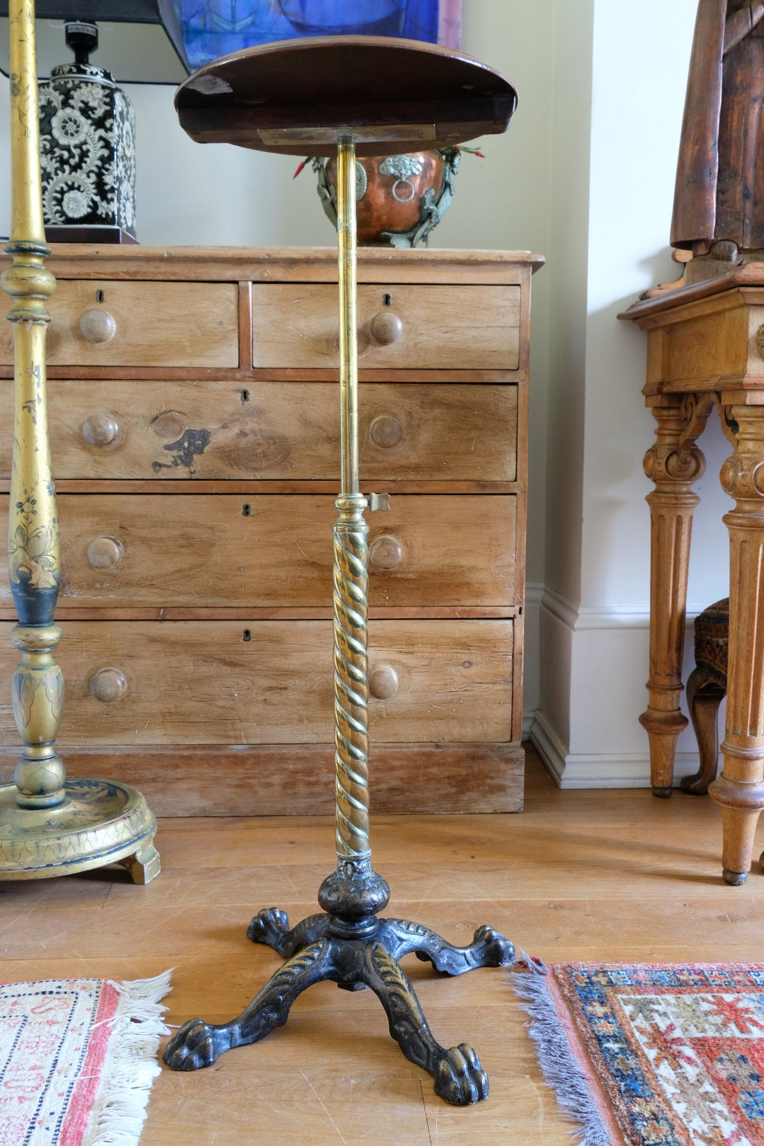 Antique brass telescopic wine table with twisted column and lions paw feet