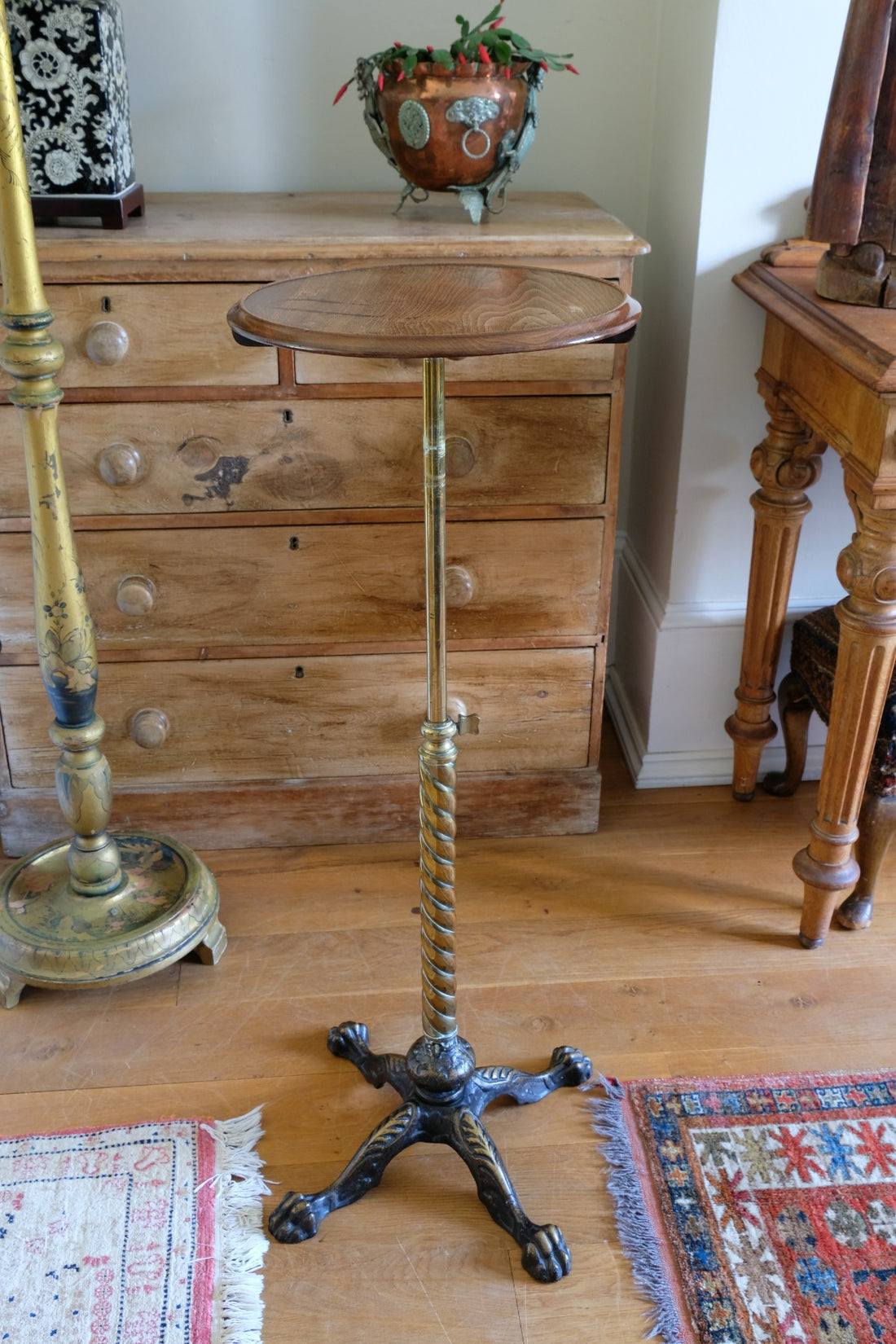 Antique brass telescopic wine table with twisted column and lions paw feet