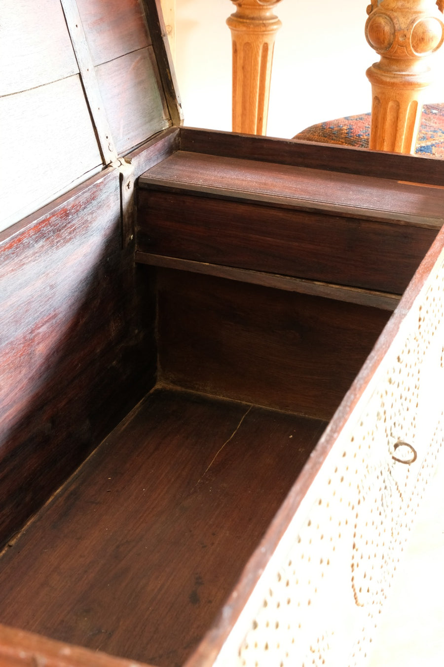 Teak Zanzibar chest decorated with brass studs raised on bun feet