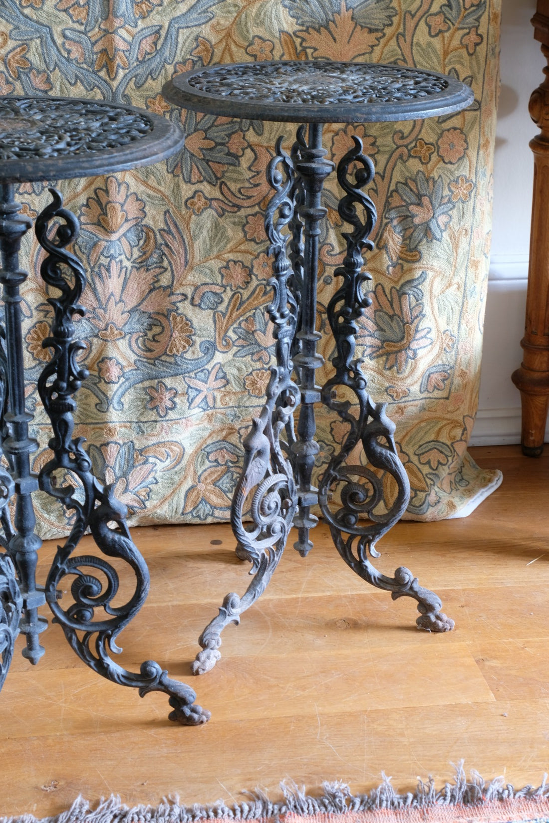 Pair of ornate cast iron tripod tables Circa 1900s