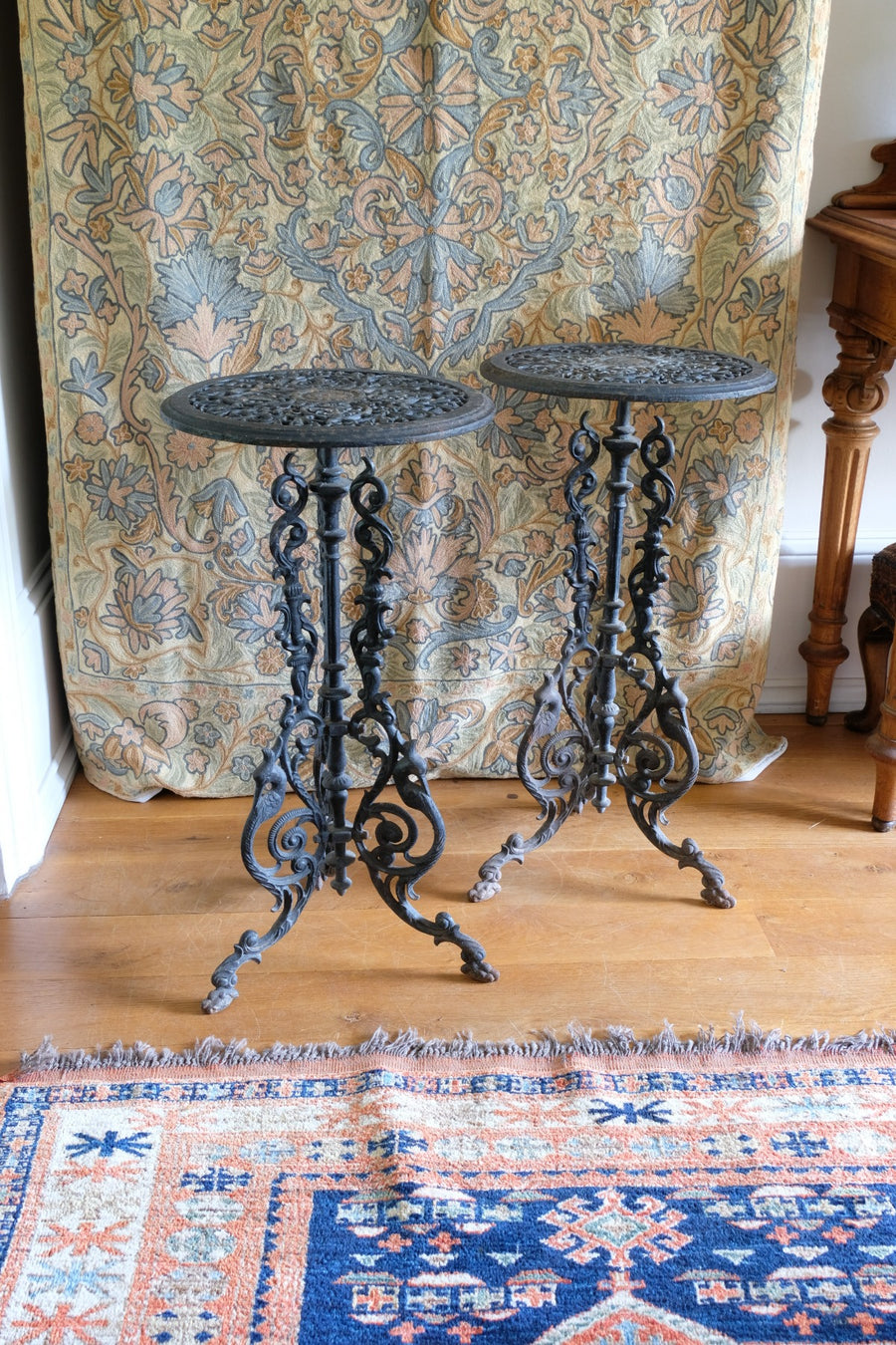 Pair of ornate cast iron tripod tables Circa 1900s