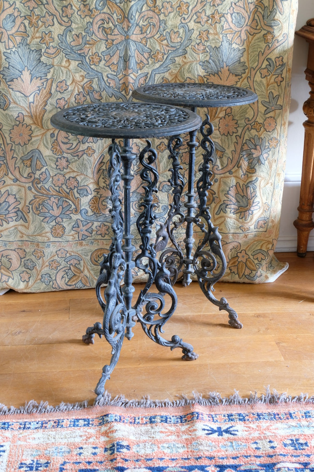 Pair of ornate cast iron tripod tables Circa 1900s
