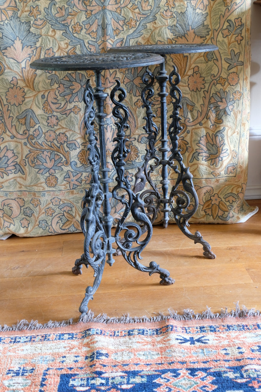 Pair of ornate cast iron tripod tables Circa 1900s