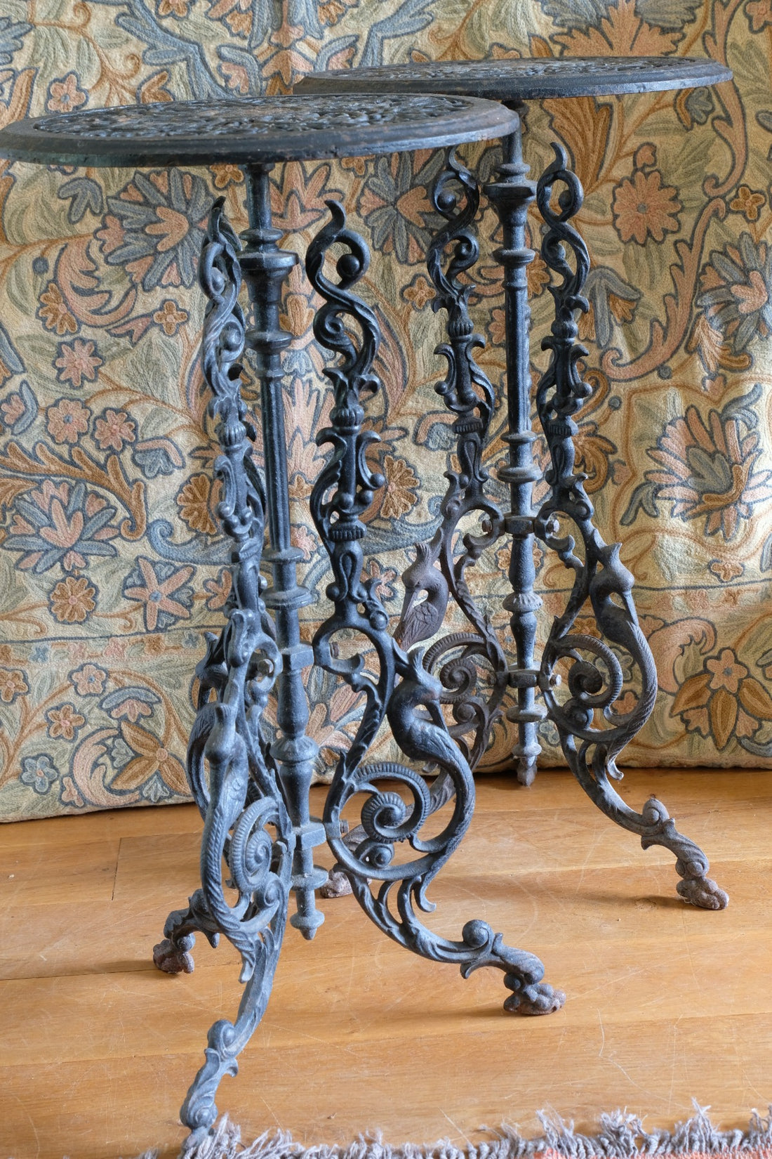 Pair of ornate cast iron tripod tables Circa 1900s