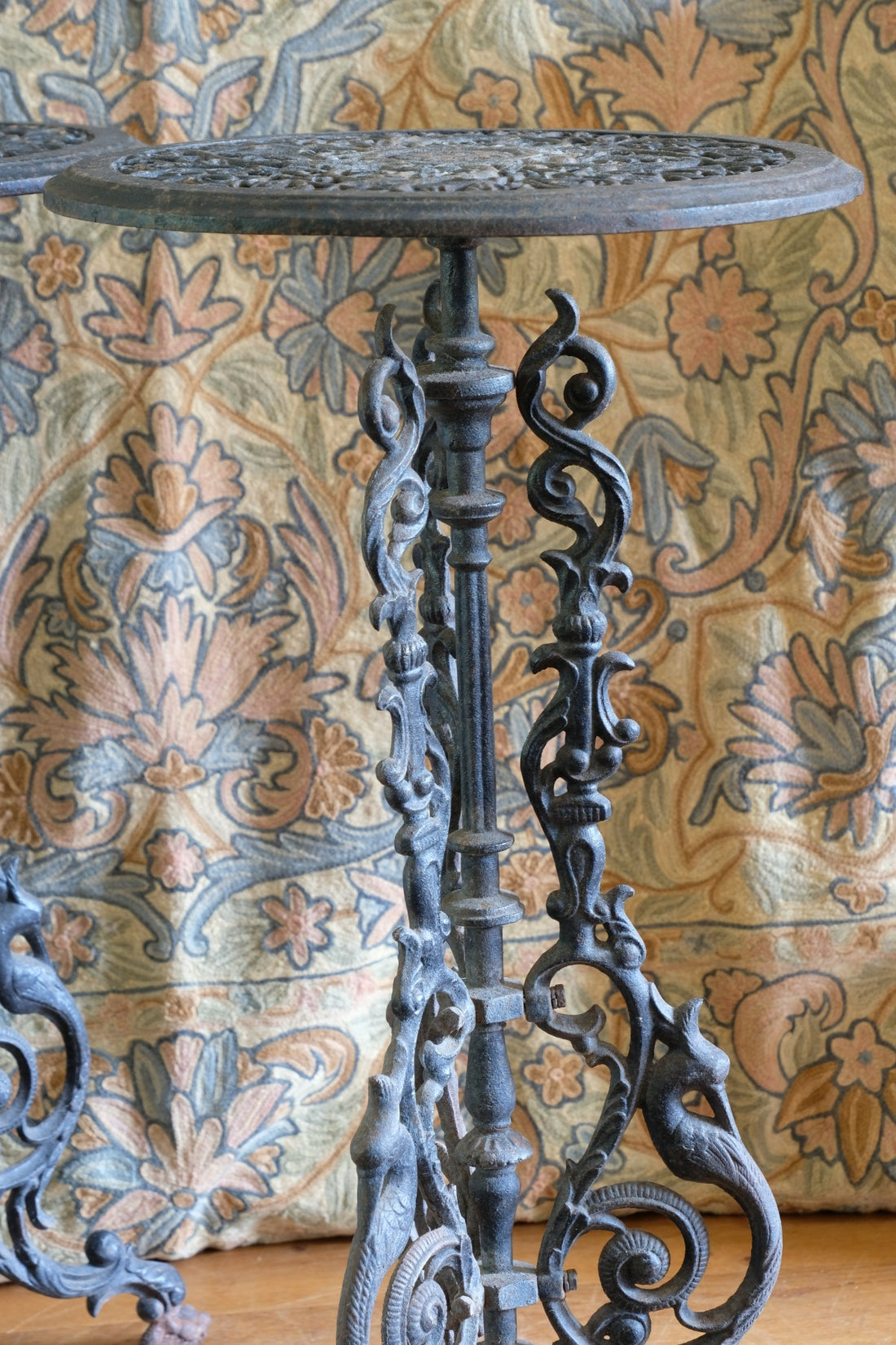 Pair of ornate cast iron tripod tables Circa 1900s