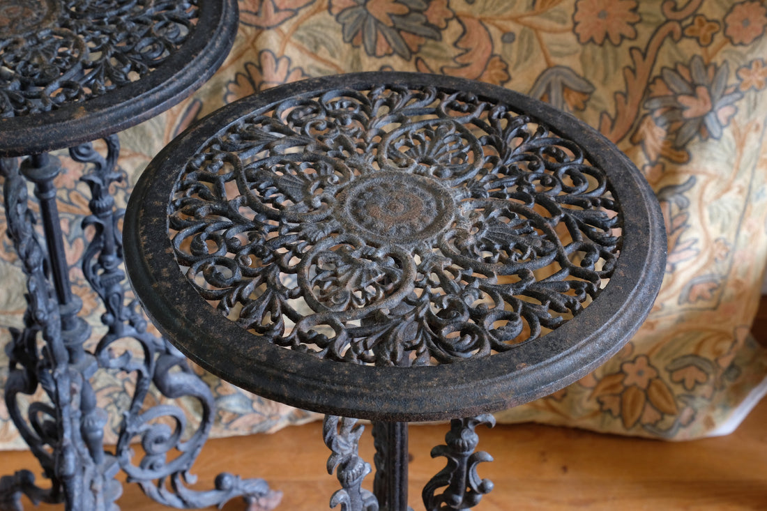 Pair of ornate cast iron tripod tables Circa 1900s