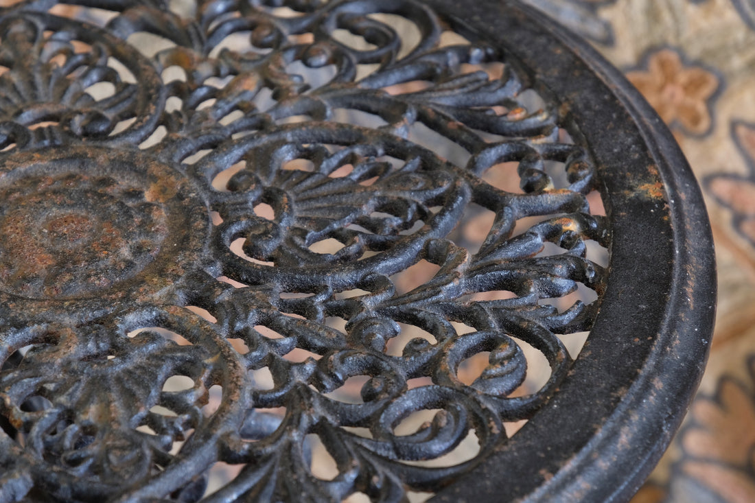 Pair of ornate cast iron tripod tables Circa 1900s