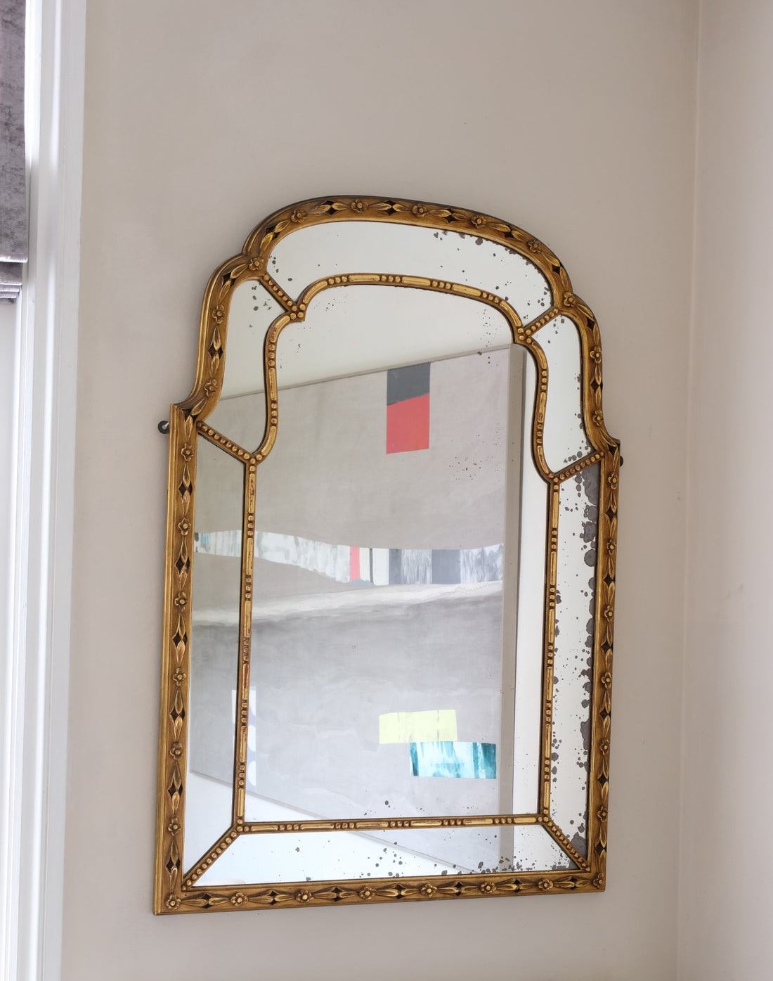 Large antique arched sectional giltwood foxed mirror circa 1910