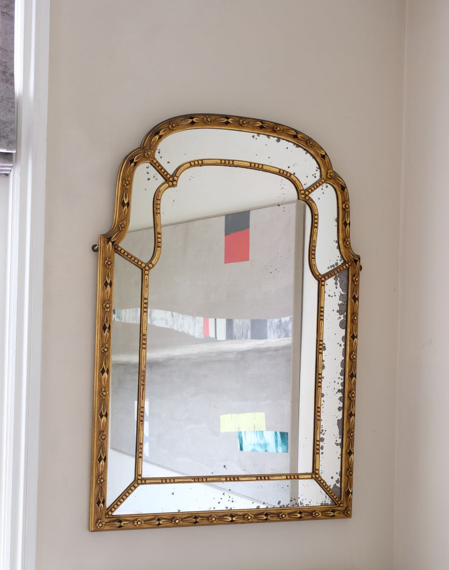 Large antique arched sectional giltwood foxed mirror circa 1910
