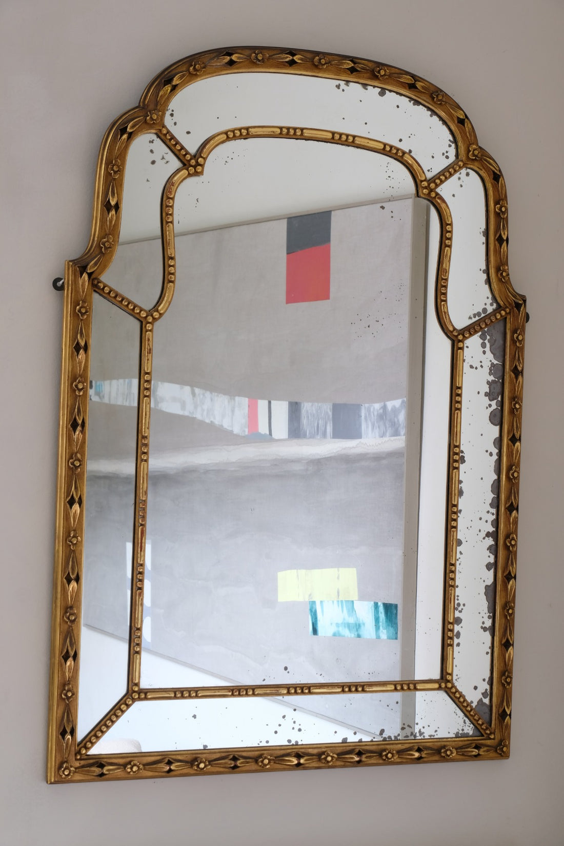 Large antique arched sectional giltwood foxed mirror circa 1910