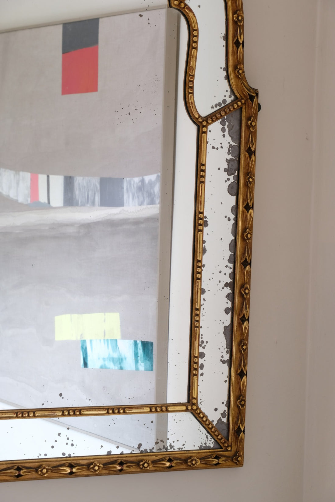 Large antique arched sectional giltwood foxed mirror circa 1910