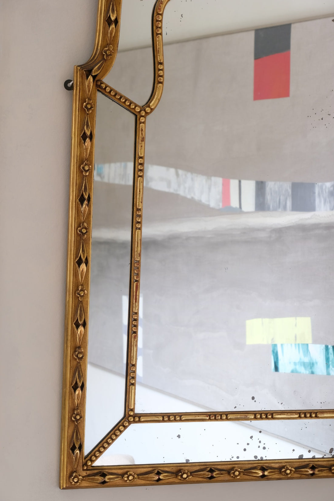 Large antique arched sectional giltwood foxed mirror circa 1910
