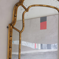 Large antique arched sectional giltwood foxed mirror circa 1910