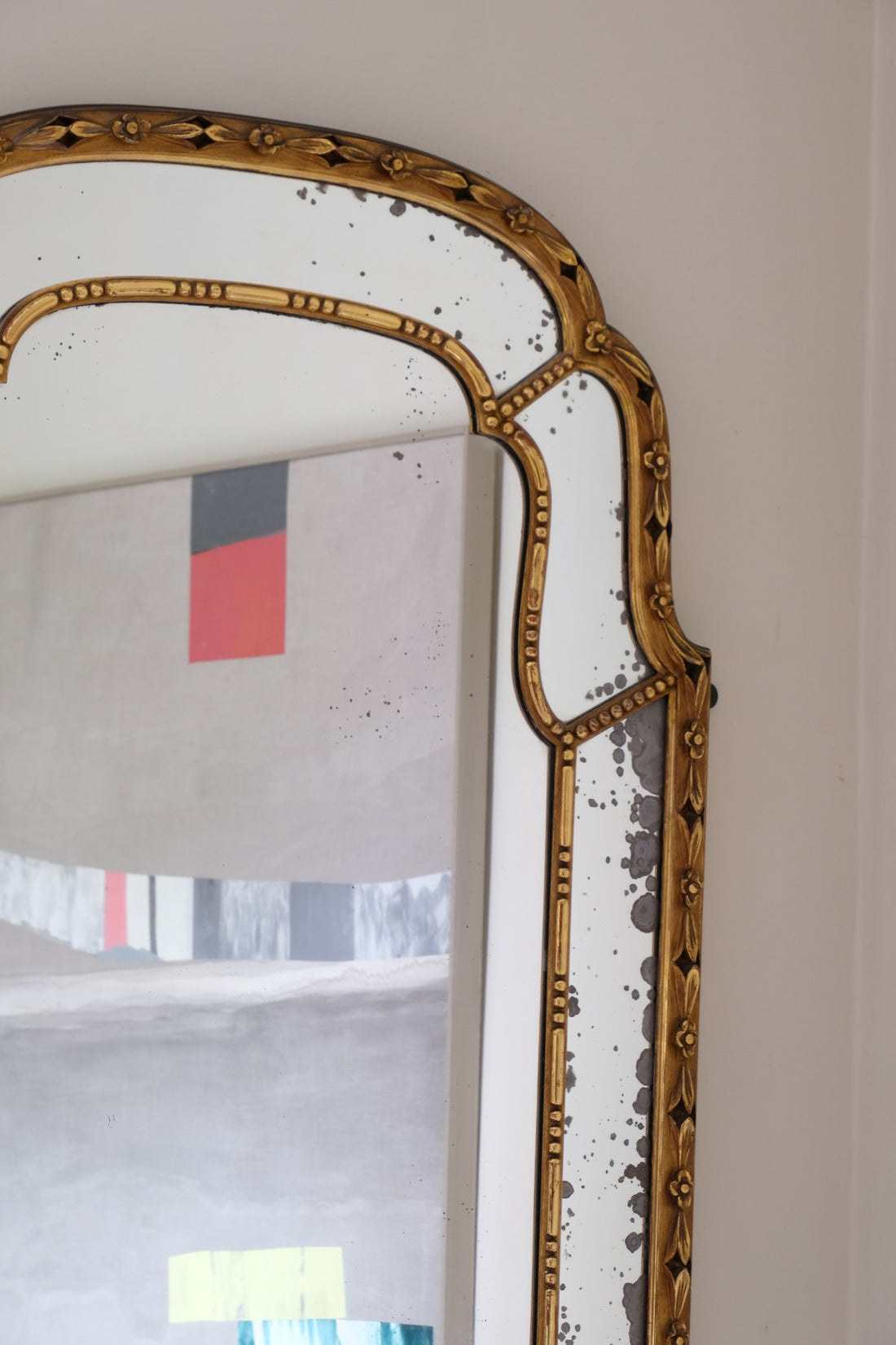Large antique arched sectional giltwood foxed mirror circa 1910