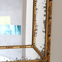 Large antique arched sectional giltwood foxed mirror circa 1910
