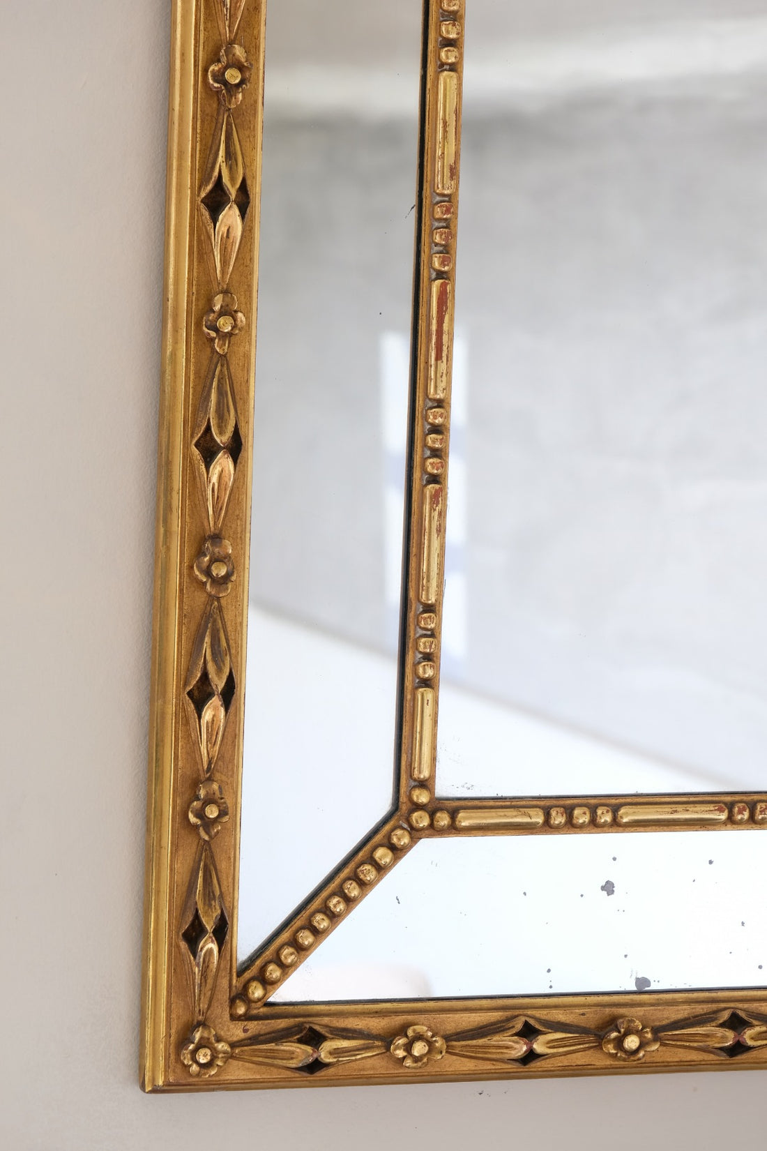Large antique arched sectional giltwood foxed mirror circa 1910