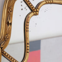 Large antique arched sectional giltwood foxed mirror circa 1910