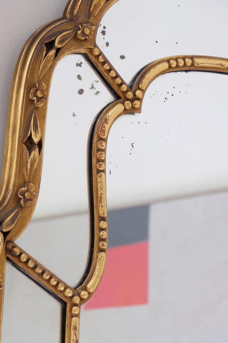Large antique arched sectional giltwood foxed mirror circa 1910