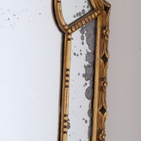 Large antique arched sectional giltwood foxed mirror circa 1910