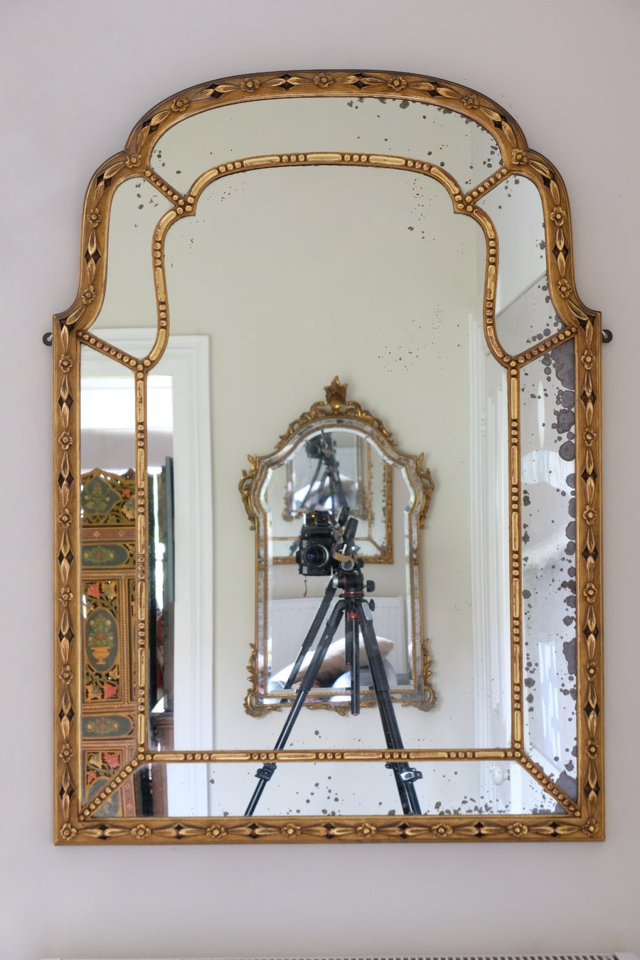 Large antique arched sectional giltwood foxed mirror circa 1910