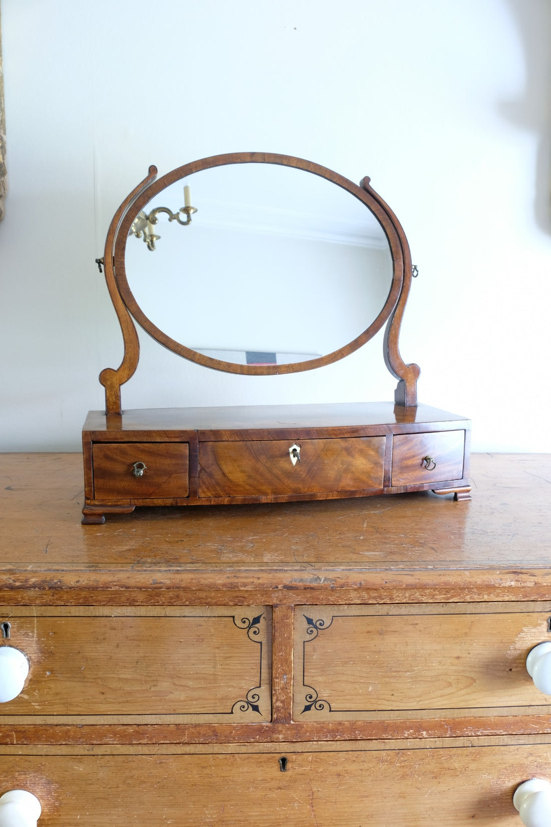 Flamed Mahogany Table Top Oval Mirror With Three Bow Fronted Drawers