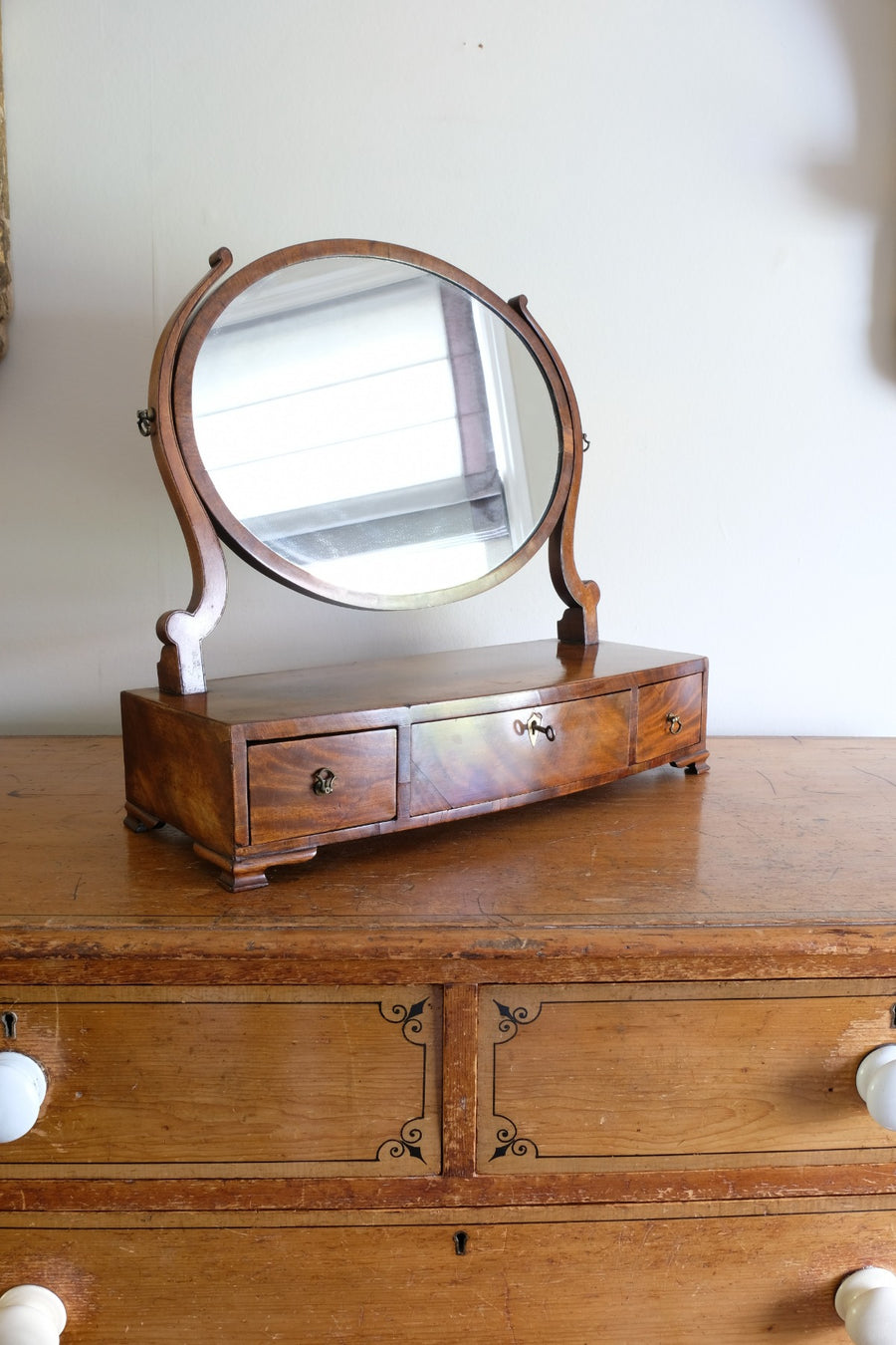 Flamed Mahogany Table Top Oval Mirror With Three Bow Fronted Drawers