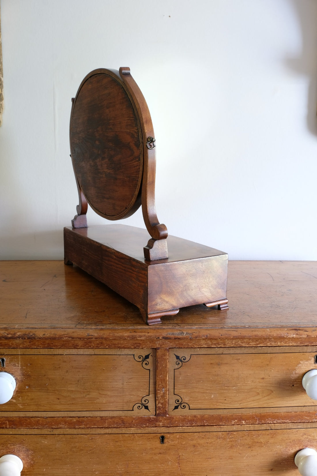 Flamed Mahogany Table Top Oval Mirror With Three Bow Fronted Drawers
