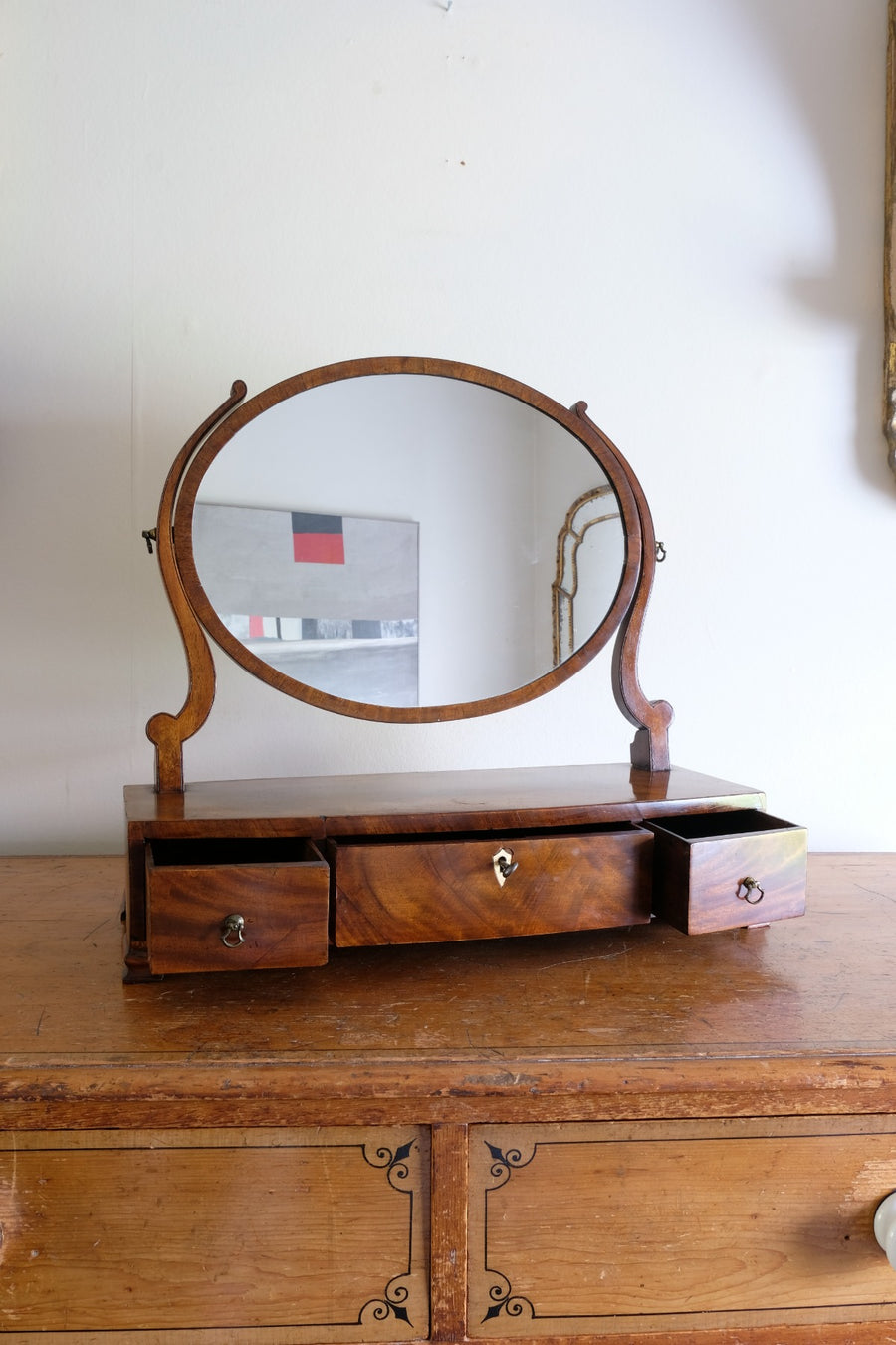 Flamed Mahogany Table Top Oval Mirror With Three Bow Fronted Drawers